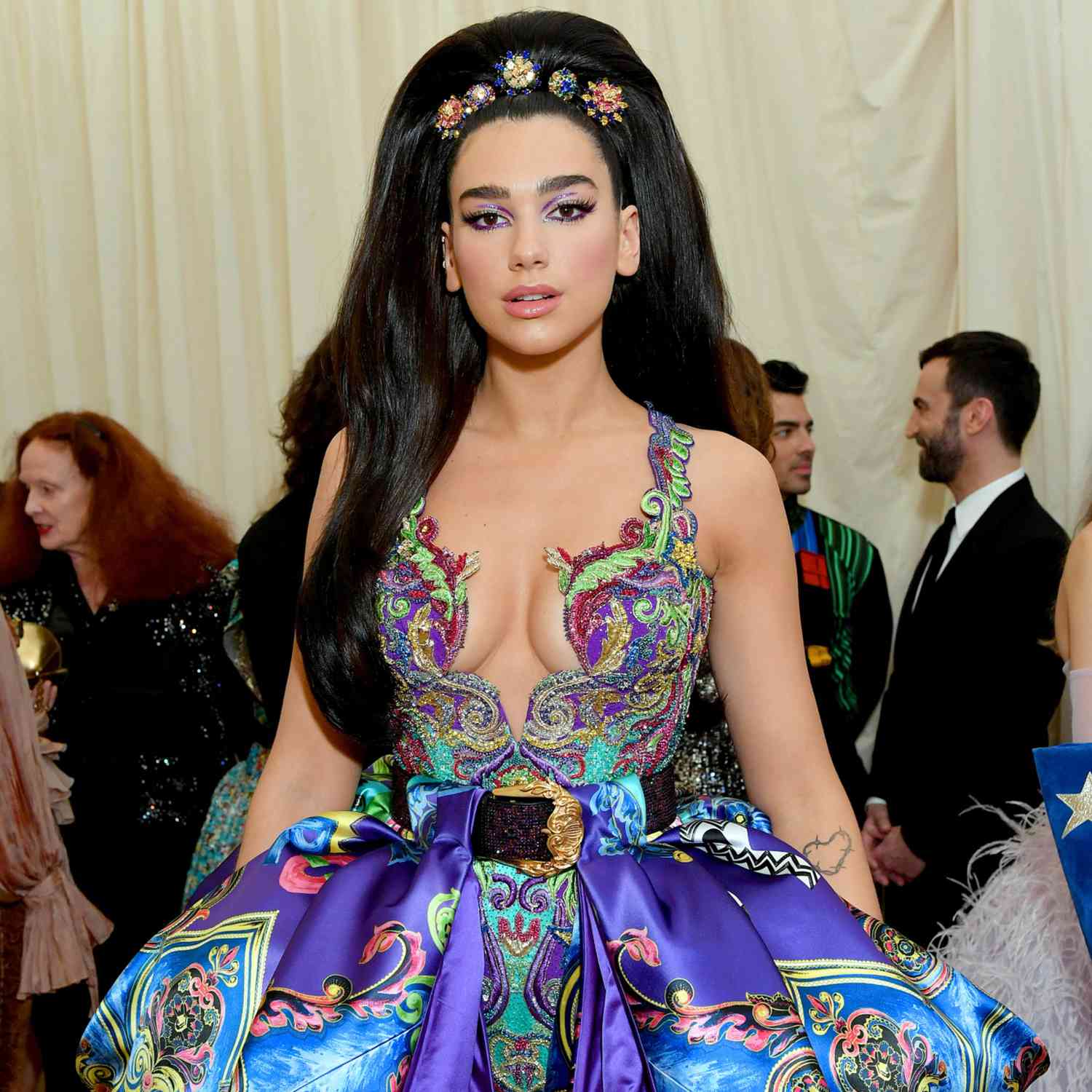 Dua Lipa at the Met Gala with a long, voluminous black bouffant 